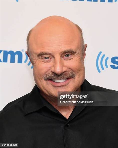 Dr. Phil McGraw: Photos Of The Talk Show Host.